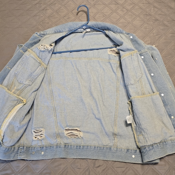 Free People classic cut denim jacket adorned with pearl accents. - Picture 5 of 9